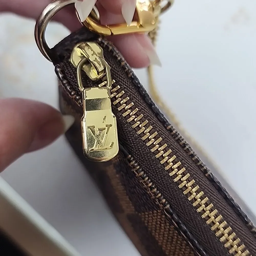 Authentic Louis Vuitton Damier Ebene Mini Pochette